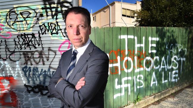 Dvir Abramovich (CHAIRMAN ANTI- DEFAMATION COMMISSION) inspects the antisemitic message and swastika.  A CAFE owned by a daughter of Holocaust survivors in Melbourne's leafy southeast was vandalised overnight. Owner, Aliza Shuvaly was deeply shocked and distressed when she arrived at her Chadstone eatery to discover the antisemitic message and swastika. Picture: Tony Gough