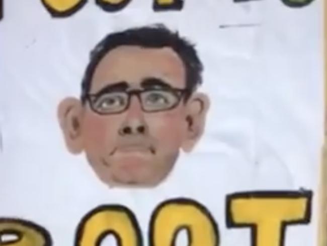 Lockdown protester Kerry Cotterill took the state’s health bosses to court after she copped a fine for protesting and carrying the sign “toot to boot” with an image of Premier Daniel Andrews.