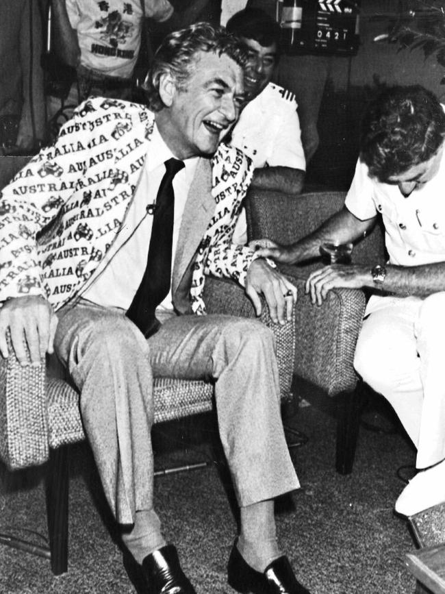 Bob Hawke, wearing an Australia II jacket, shares the moment of victory after Australia II won the America's Cup race in 1983.