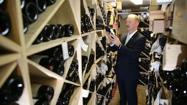 Sommelier Luke Collard at work in the wine cellar at Jonah’s. Picture: Martin Lange