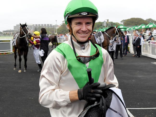 Jockey Jason Collett after taking out the feature race on Cradle Mountain.