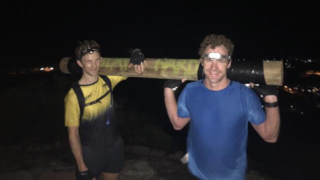 Sam Stow (left) and Rob Ormsby at the top of Mount Coolum, completing the David Goggins' 4x4x48 challenge.