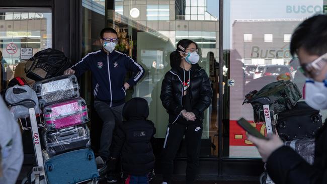 Masked travellers are seen at Malpensa Airport in Italy. Picture: Getty Images