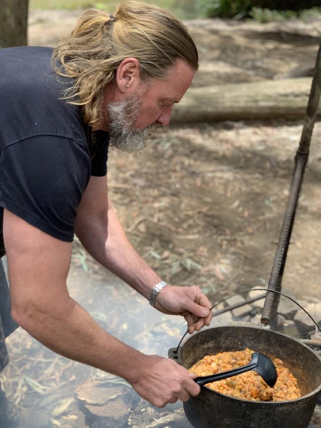 Redleaf Farm co-owner Sam Sparke cooks over a campfire. Picture: Jenifer Jagielski