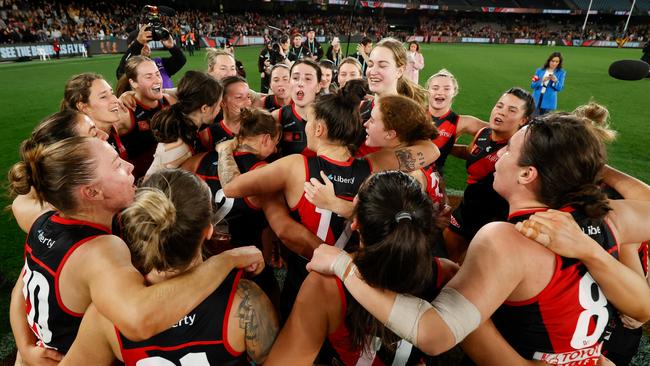 Bombers players sing the team song after their first win in AFLW. Picture: Michael Willson/AFL Photos via Getty Images