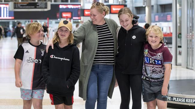 Skye Seddon with Kurtis 13, Tyson 10, Kaylee 15, and Blake, 8, at Brisbane Airport. Picture: Lachie Millard