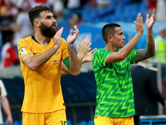 Veterans Mile Jedinak and Tim Cahill thank the Aussie supporters. Picture: Toby Zerna