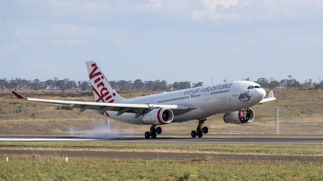 A Virgin Australia Airbus A330-200 lands at Wellcamp Airport for storage. Friday. 25th Sep 2020