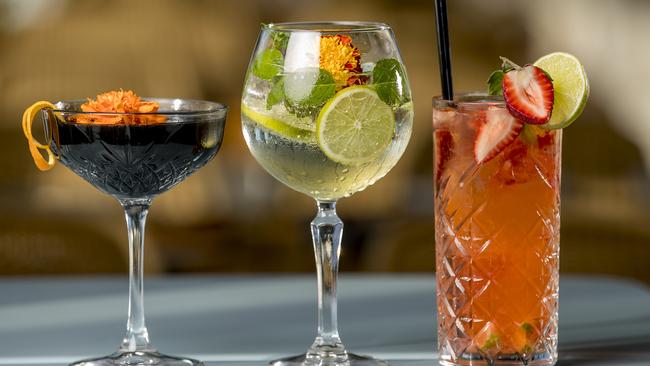 A selection of cocktails at the Aviary rooftop bar, (from left) Blackswan, Flowered Love Bird, and Rosella cocktails. Picture: Jerad Williams