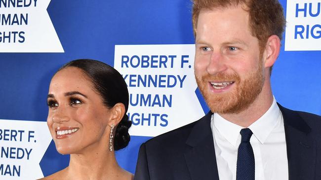 (FILES) Prince Harry, Duke of Sussex, and Meghan, Duchess of Sussex, arrive at the 2022 Robert F. Kennedy Human Rights Ripple of Hope Award Gala at the Hilton Midtown in New York City on December 6, 2022. Prince Harry and wife Meghan Markle were involved in a "near catastrophic car chase" involving paparazzi in New York late on May 16, 2023, a spokesperson for the couple said May 17. "This relentless pursuit, lasting over two hours, resulted in multiple near collisions involving other drivers on the road, pedestrians and two NYPD officers," the spokesperson added. (Photo by ANGELA WEISS / AFP)