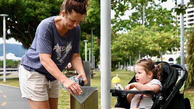 Katie Townsend, with two year old Harmony Townsend, is worried about the burden the rate rises will put on North Queenslanders. Picture: Isaac McCarthy.