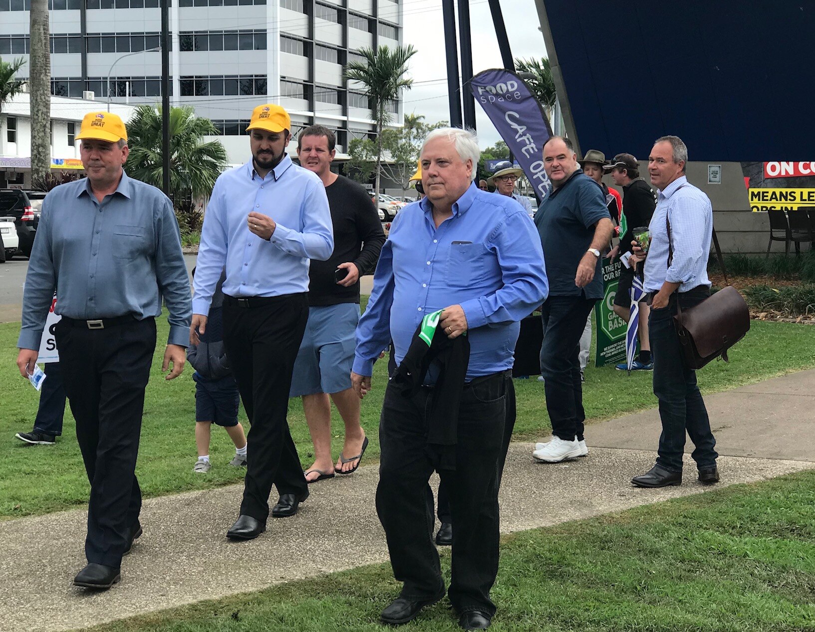 Clive Palmer arrives to back Adani against environmentalist activists. 