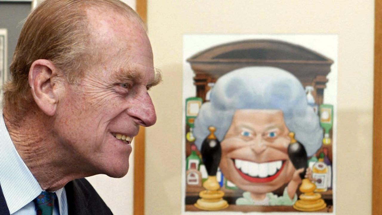 Prince Philip, Duke of Edinburgh stands next to a cartoon of his wife Queen Elizabeth II, standing behind the bar in the Old Vic pub from the TV show Eastenders. Picture: AFP