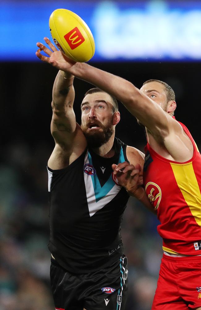 Dixon tried hard against mighty Suns’ ruckman Jarrod Witts. Picture: AFL Photos/Getty Images