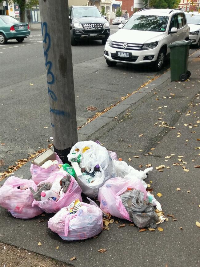 Rubbish bags dumped on the pavement on Chetwynd St, North Melbourne. Picture: Snap Send Solve