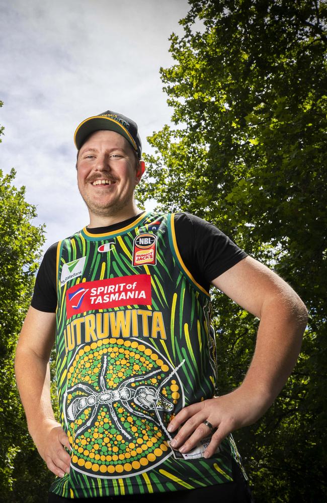 Indigenous artist Reuben Oates wearing his JackJumpers dot design jersey. Picture: Chris Kidd