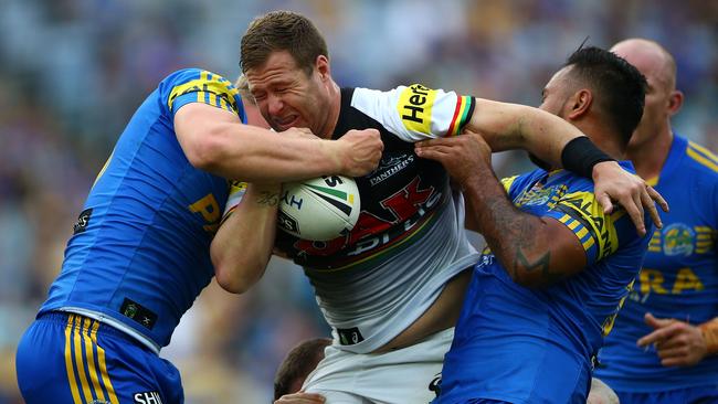 SYDNEY, AUSTRALIA — APRIL 22: Trent Merrin of the Panthers is tackled during the round eight NRL match between the Parramatta Eels and the Penrith Panthers at ANZ Stadium on April 22, 2017 in Sydney, Australia. (Photo by Matt Blyth/Getty Images)