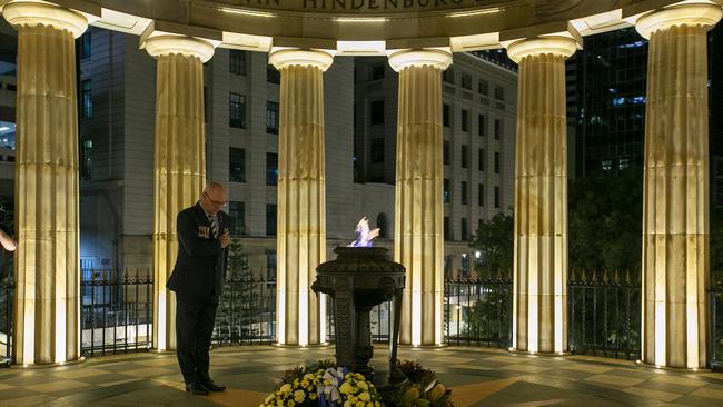 Tony Ferris of the RSL has a moment during the Anzac Day Wreath Laying Ceremony at The Shrine of Remembrance in Brisbane, Saturday, April 25, 2019. Anzac Day is a national day of remembrance to commemorate the service and sacrifice of Australian and New Zealand service men and women. Due to COVID-19 restrictions marches and commemorative services have been banned for the first time in more than a century. (AAP Image/Jono Searle) NO ARCHIVING
