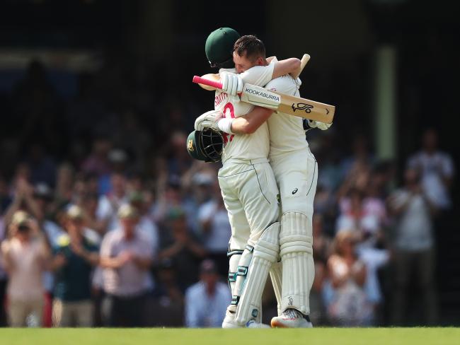 Marnus Labuschagne celebrates his century with teammate Steve Smith on day one. Picture: Brett Costello