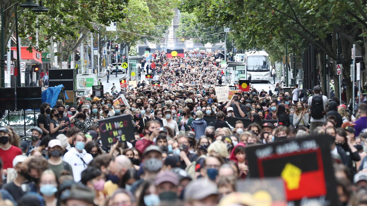 Protesters march through Melbourne. Picture: NCA NewsWire/ David Crosling.