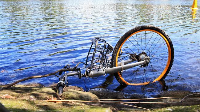 A submerged oBike discarded along the Yarra River in Melbourne during the brand’s short-lived stay. Picture: Aaron Francis/The Australian