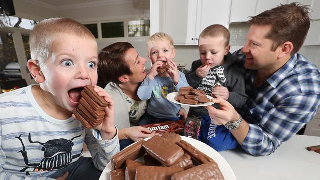 Kate and her husband Ryan, along with their sons, Jack, 6, Samuel, 4, and Matthew, 2, love Original Tim Tams. Picture: Alex Coppel