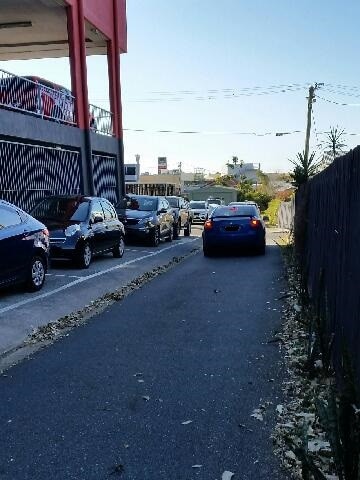 A car goes the wrong way down a laneway at East St, Lutwyche. Supplied by Shelley Threfall.