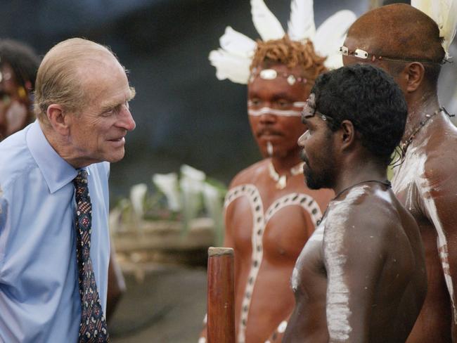 The Duke of Edinburgh talks to Aboriginal performers after watching a culture show at Tjapukai Aboriginal Culture Park, Cairns, Queensland, in 2002. The Duke surprised the performers when he asked them “Do you still throw spears at each other?”. Picture: PA Images via Getty Images