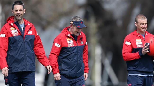 Melbourne assistant coach Jade Rawlings with senior coach Simon Goodwin and assistant Brendan McCarthy. Picture: Michael Klein