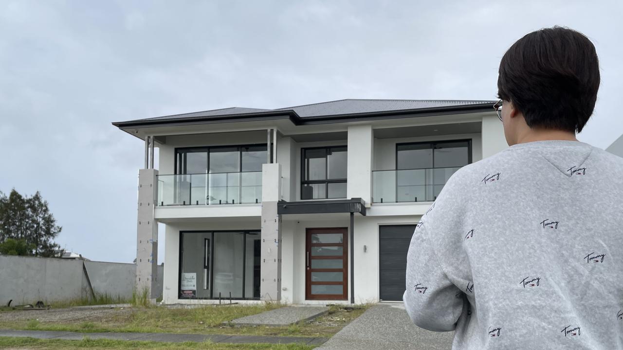 Home buyer “Sherry” outside her family's unfinished home, which has been left in limbo by the collapse of Gold Coast builder Skyfield Homes.