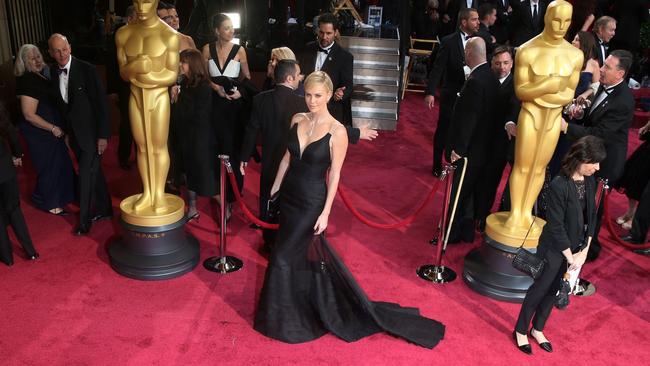 Much time, preparation and money would have gone into Charlize Theron’s stunning look on the Oscars red carpet. Picture: J. Emilio Flores/Corbis via Getty Images