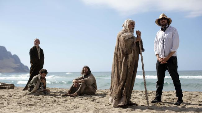 Australian director Garth Davis (in hat) with actors Tcheky Karyo (with stick) and Joaquin Phoenix (in middle) on the Italian set of Mary Magdalene.