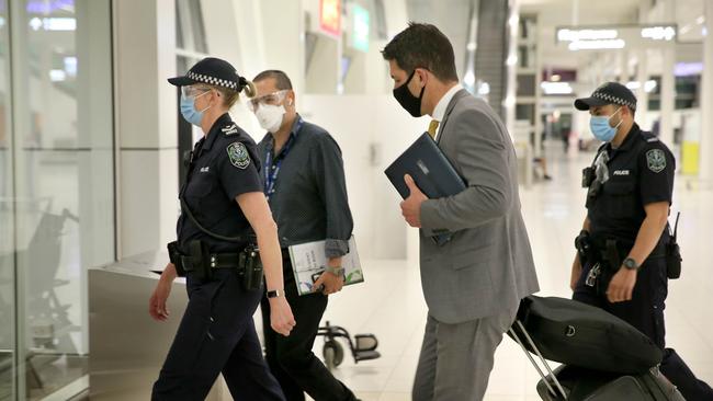 SA Police escort Liberal Senator Alex Antic to a medi-hotel reserved for unvaccinated travellers to SA. Picture nDean Martin