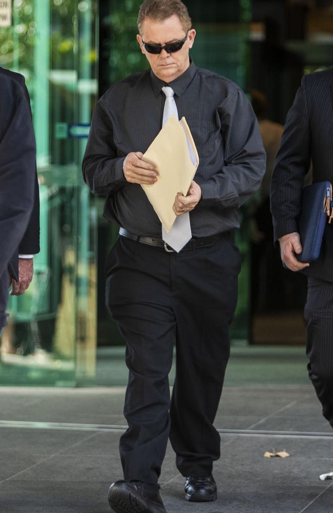 Queensland Police Senior Constable Neil Punchard leaves the Magistrates Court in Brisbane last year. Picture: AAP Image/Glenn Hunt