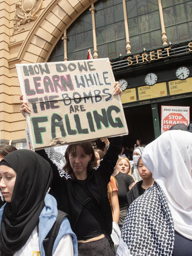 Crowds march from Flinders Street Station. Picture: Nicki Connolly