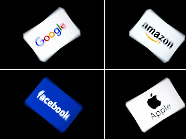 (FILES) In this file photo taken on February 18, 2019 (COMBO) This combination of pictures shows the logos of the GAFA's, named after US  multinational technology and Internet-related services company Google, US online retail giant Amazon, US social media Facebook and US multinational technology company Apple, displayed on a tablet in Paris, on February 18, 2019. - Apple on July 30, 2020, reported higher profits in the past quarter, with strong gains in sales of wearables, accessories and services amid a global pandemic. Amazon on Thursday reported that its profit in the recently ended quarter doubled as sales soared during the pandemic. Google parent Alphabet reported a rare drop in revenue and profit on Thursday in a quarterly update that nonetheless topped market expectations. Facebook reported Thursday that its quarterly profit had nearly doubled and users grew despite a boycott by advertisers. (Photo by Lionel BONAVENTURE / AFP)