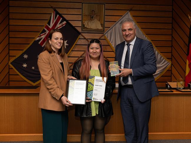 Creative Arts Award recipient Tammy Dang (centre) receiving the award.