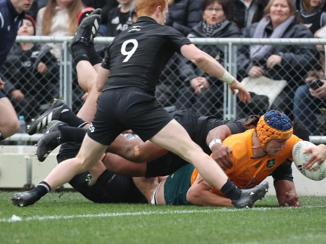 Tom Hooper of Australia drives over to score.