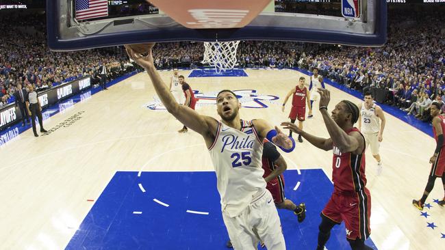 Philadelphia 76ers’ Ben Simmons, left, shoots against Miami Heat in game two of their first-round NBA playoff series in Philadelphia. Picture: AP