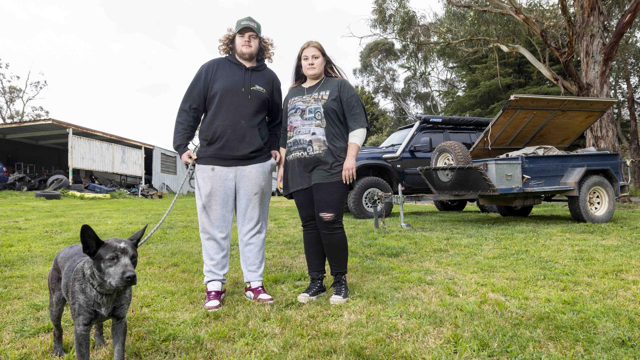 Victim Brock Momcilivic and his girlfriend Jedha Kinder with dog Pablo stand in front of their car and Camper that was stolen and driven away as they slept inside it. Picture by Wayne Taylor