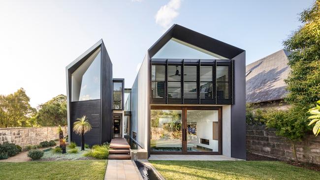 Dubbed the Iron Maiden house because of its liberal use of metal, this family home  designed and built by C+C Architectural Workshop, has turned in on itself and created its own outlook.