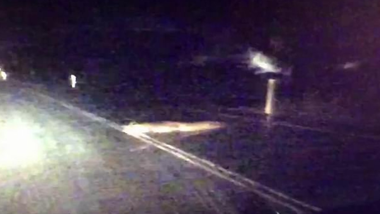 Police released this dashcam footage of a croc on a highway during Cyclone Owen. Picture: Queensland Police.