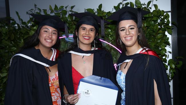 Mia Farrugia, Laura Burgess and Georgia Waddell celebrate graduation. Picture: Alan Barber
