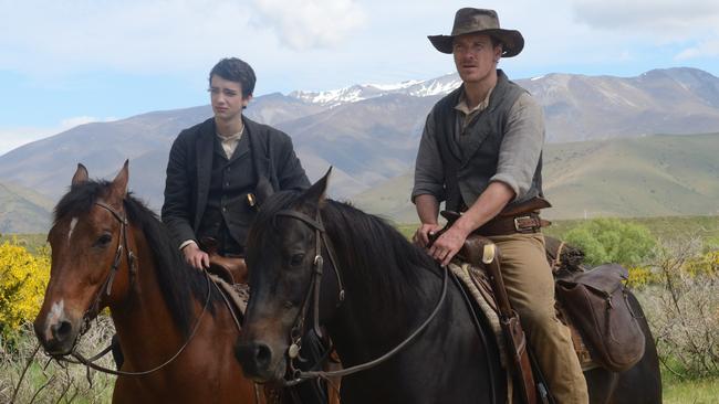 Kodi Smit-McPhee and Michael Fassbender in Slow West.