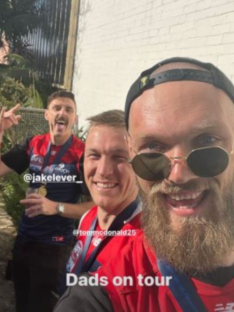 Max Gawn with premiership teammates Jake Lever and Tom McDonald.