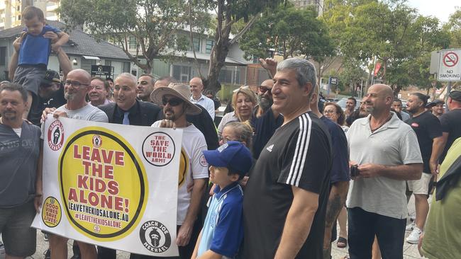 Cumberland councillor Steve Christou with supporters who oppose drag queen story time despite.