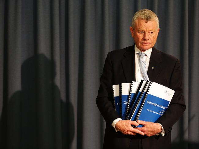 Acting Ombudsman, Professor John McMillan delivers his findings yesterday. Picture: Carly Earl