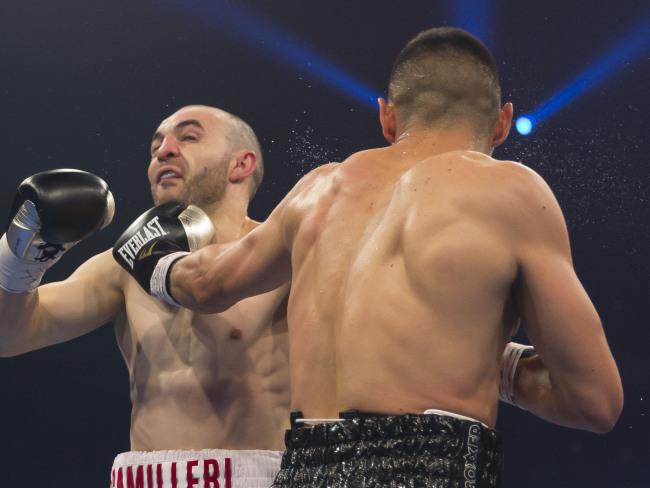 Tim Tszyu (R) lands a telling blow on Joel Camilleri. Picture: AAP