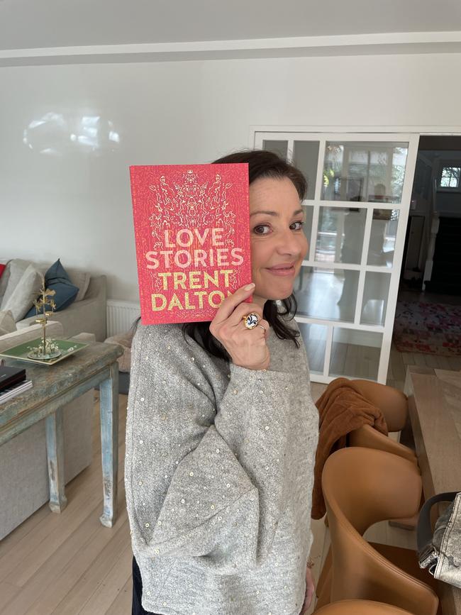 Tina Arena with her copy of Trent Dalton's Love Stories. Picture: Andrew McMillen