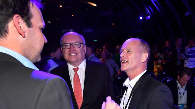 Former Queensland Premier Campbell Newman (right) is seen talking to Senator Matthew Canavan (left) and Senator George Brandis (centre) at the LNP campaign launch. Picture: AAP Image/Darren England